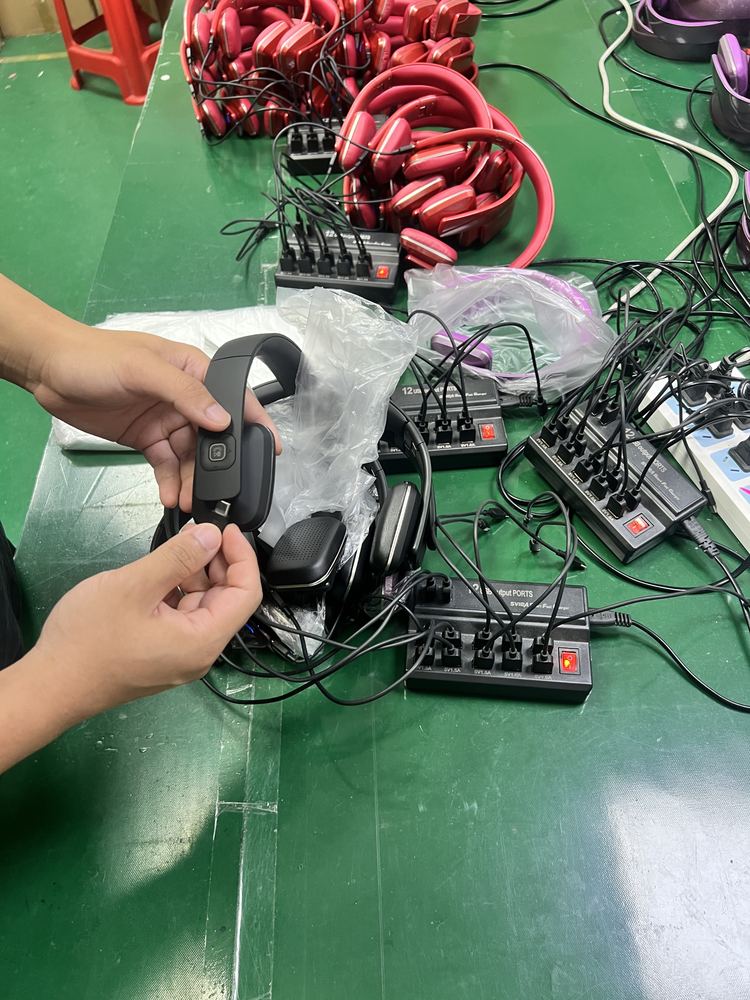 Bluetooth headphone component assembly and cable checking at workbench